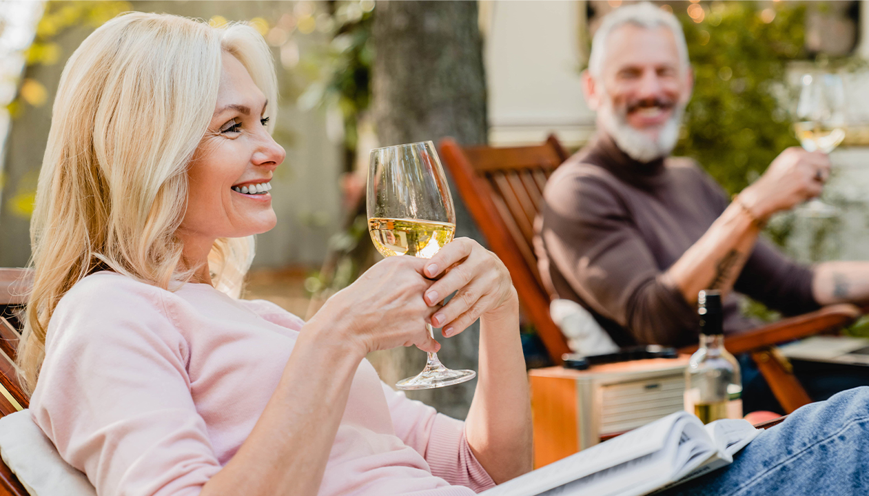 luxury home designs woman and man smiling drinking wine